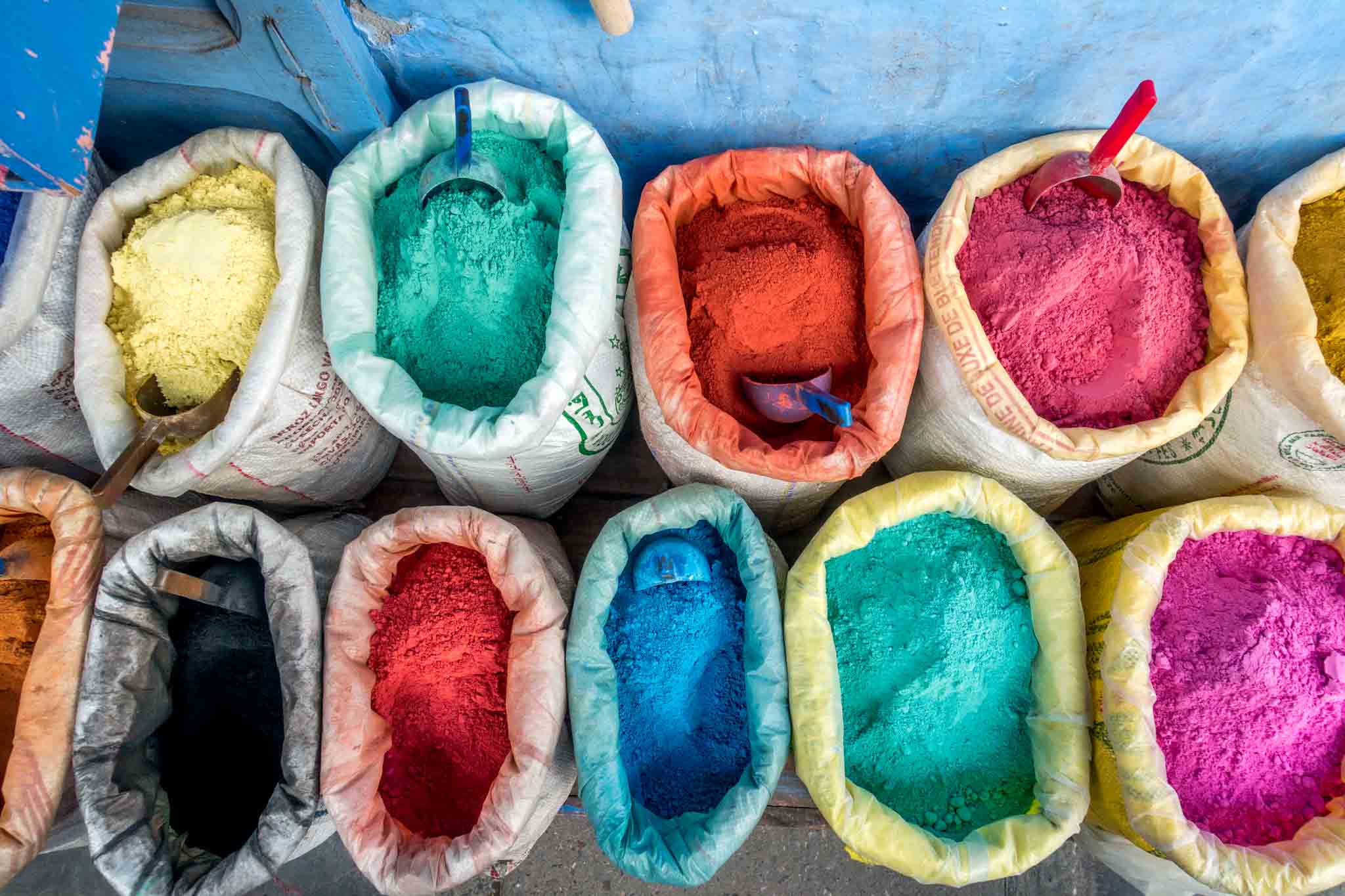 Brightly-colored pigments in bags.