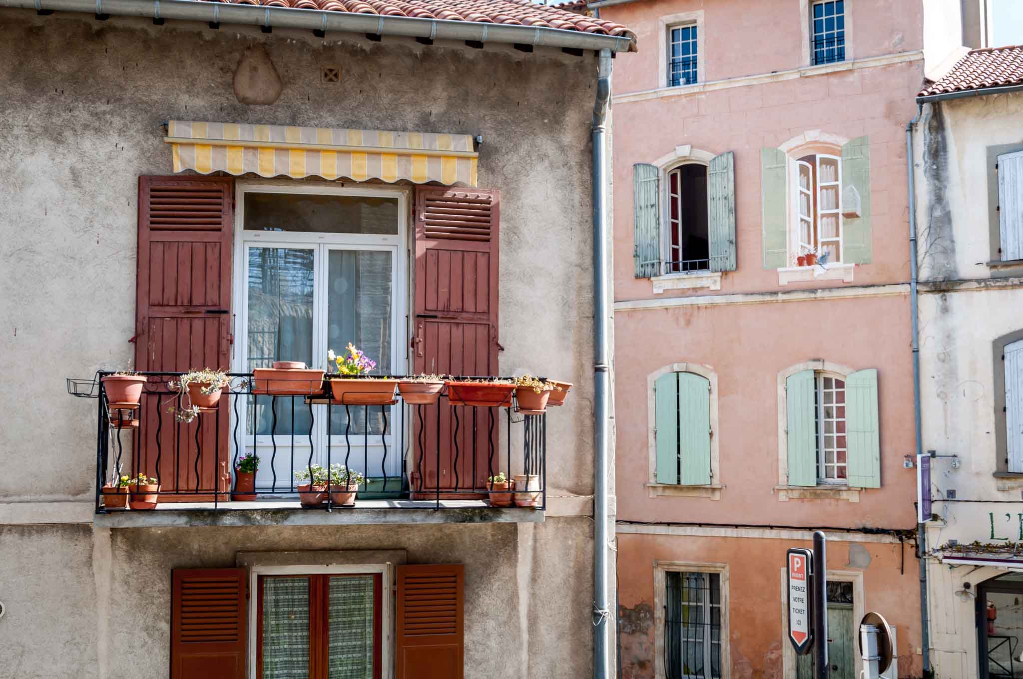 Colorful window shutters on a 10-day South of France itinerary 