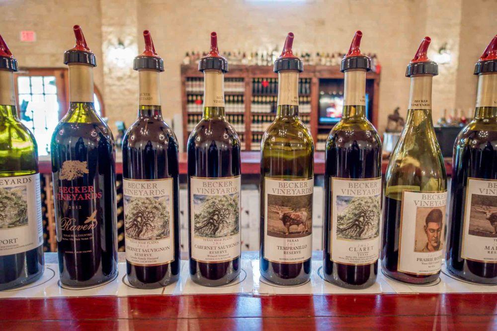 Wine bottles from Becker vineyard lined up on a bar