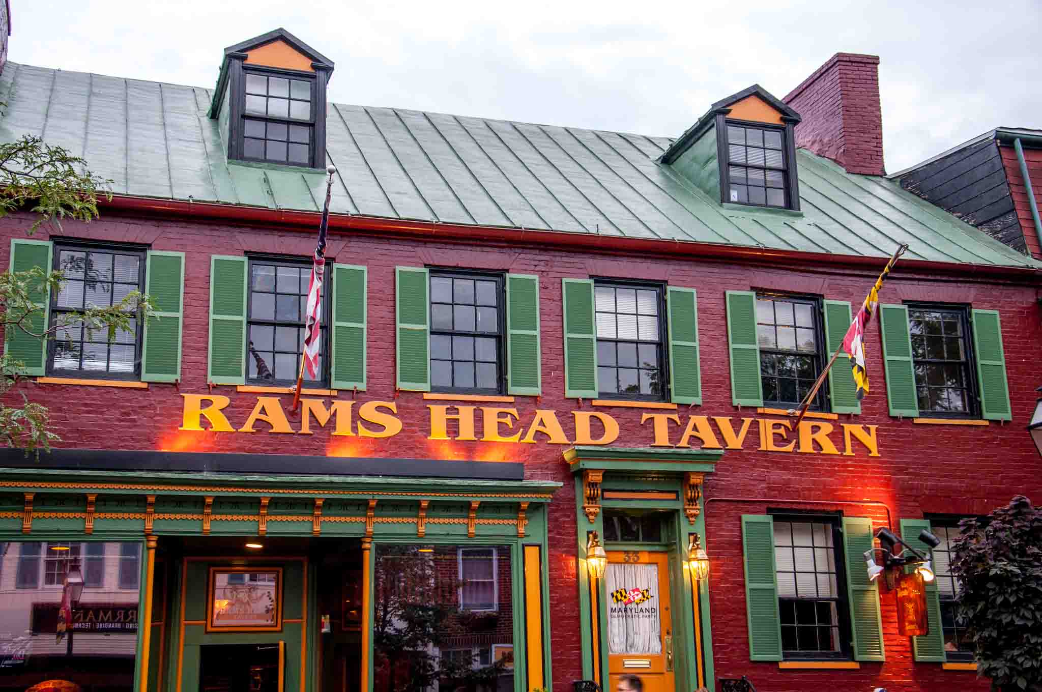 Painted red brick exterior of Rams Head Tavern.