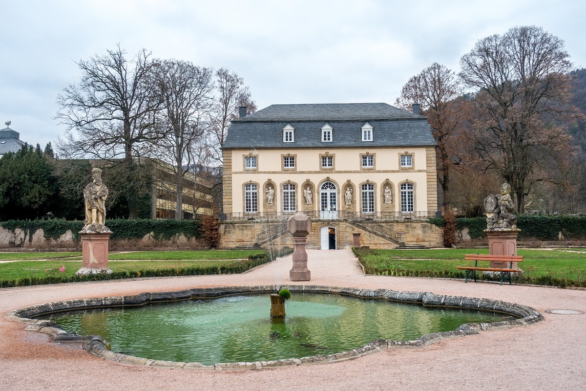 White building and pond, the Orangerie at Echternach Abbey in Luxembourg