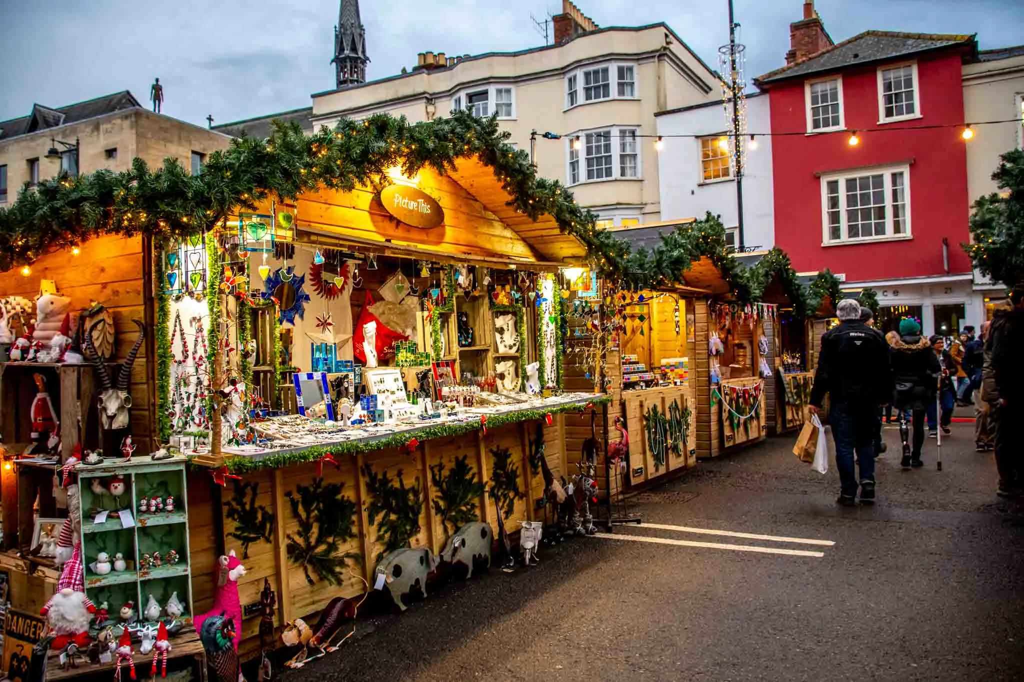 Wooden chalets seeling merchandise at the Oxford Christmas Market in England
