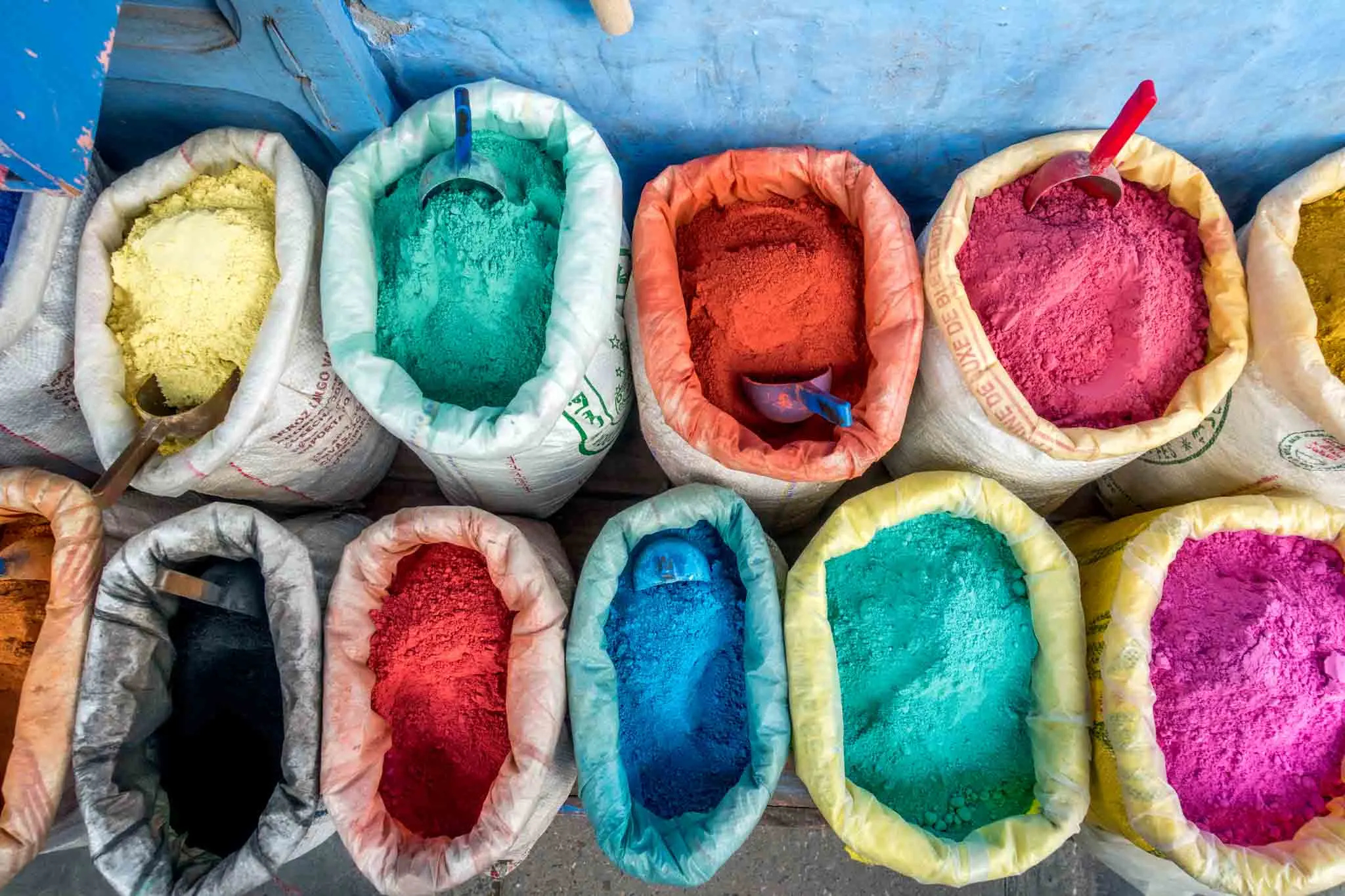 Brightly-colored pigments in bags.